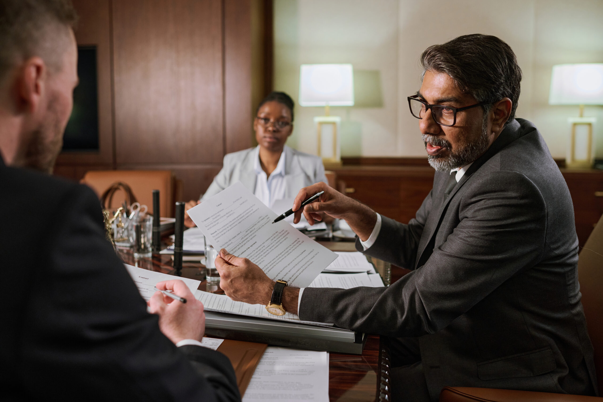 Medical experts with lawyers inside an office